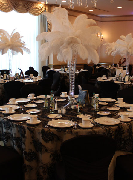 Black candelabra ostrich feathers centerpiece - RentalCenterpiece